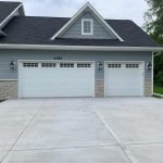 grey house with white garage door